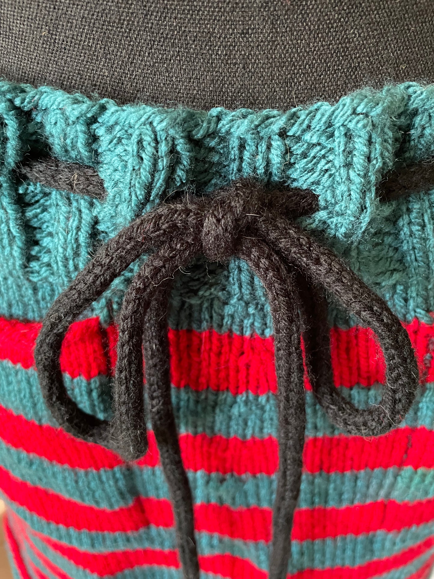 Hand Knitted Teal and Poppy Striped Skirt with Black Knitted Drawstring .