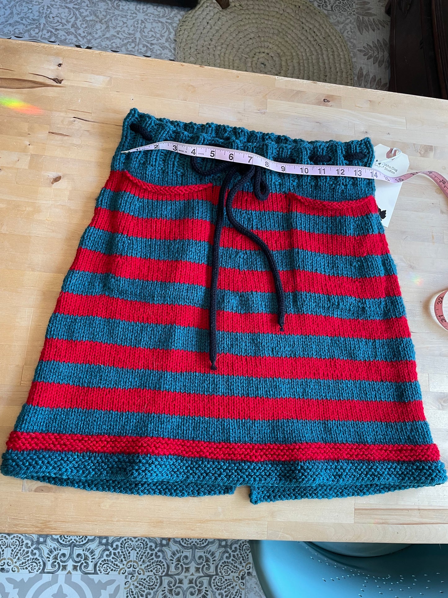 Hand Knitted Teal and Poppy Striped Skirt with Black Knitted Drawstring .