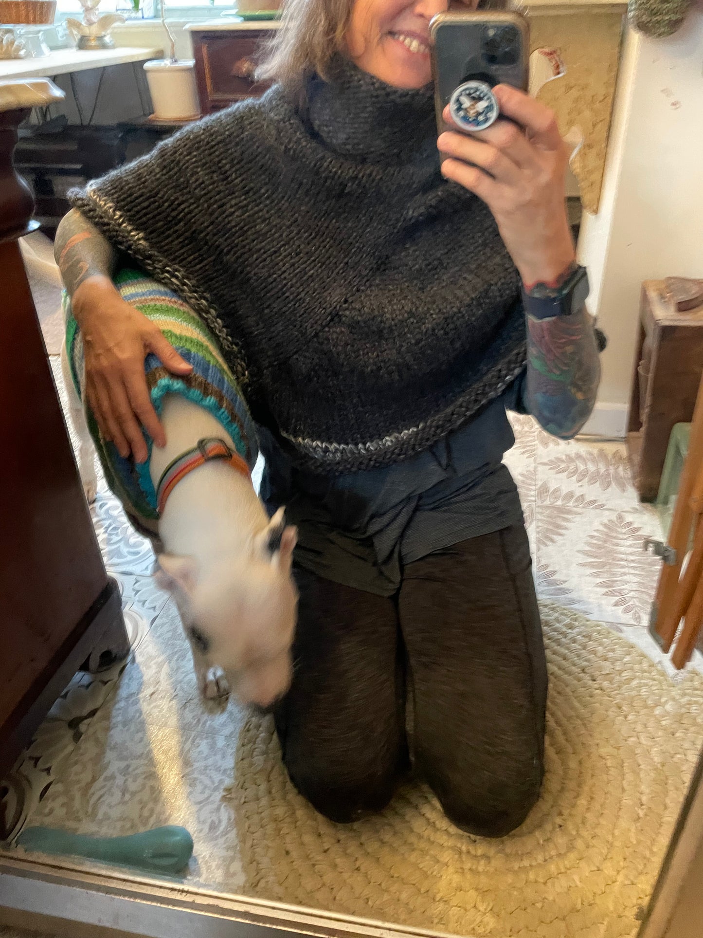 Hand knitted rolled turtleneck poncho charcoal grey with striped edging