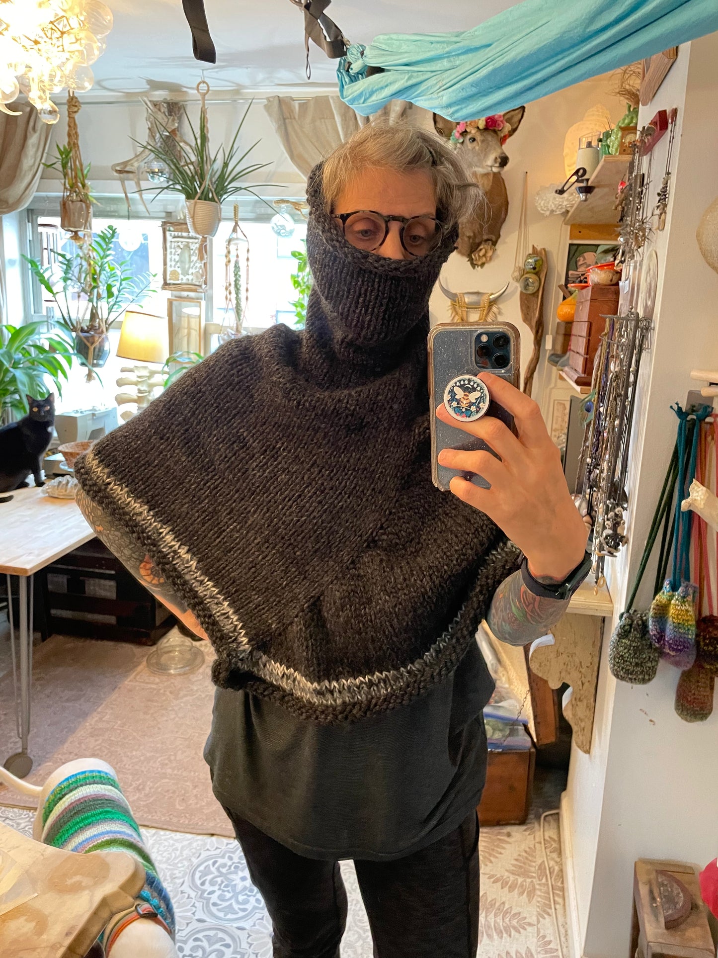 Hand knitted rolled turtleneck poncho charcoal grey with striped edging