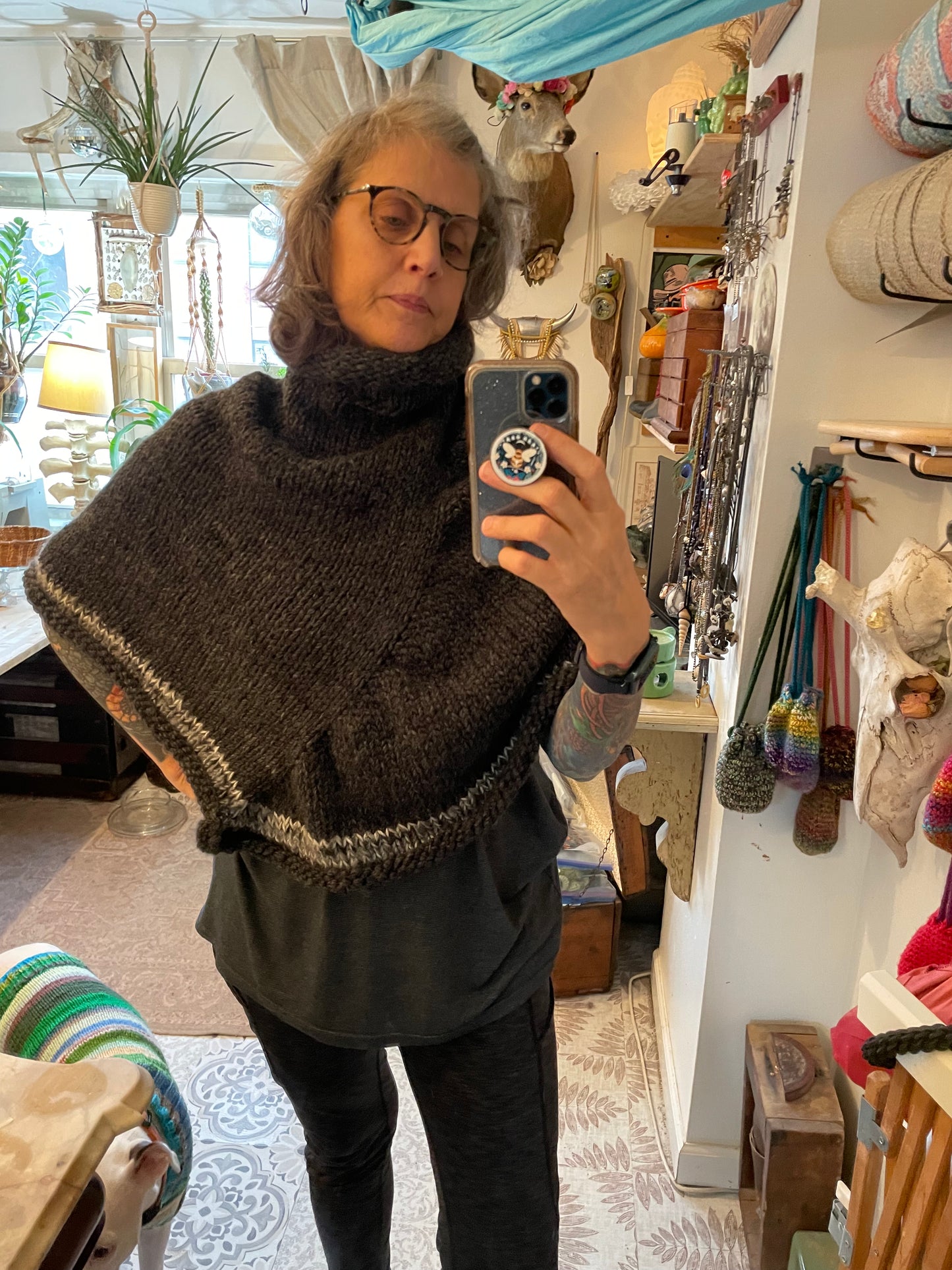 Hand knitted rolled turtleneck poncho charcoal grey with striped edging