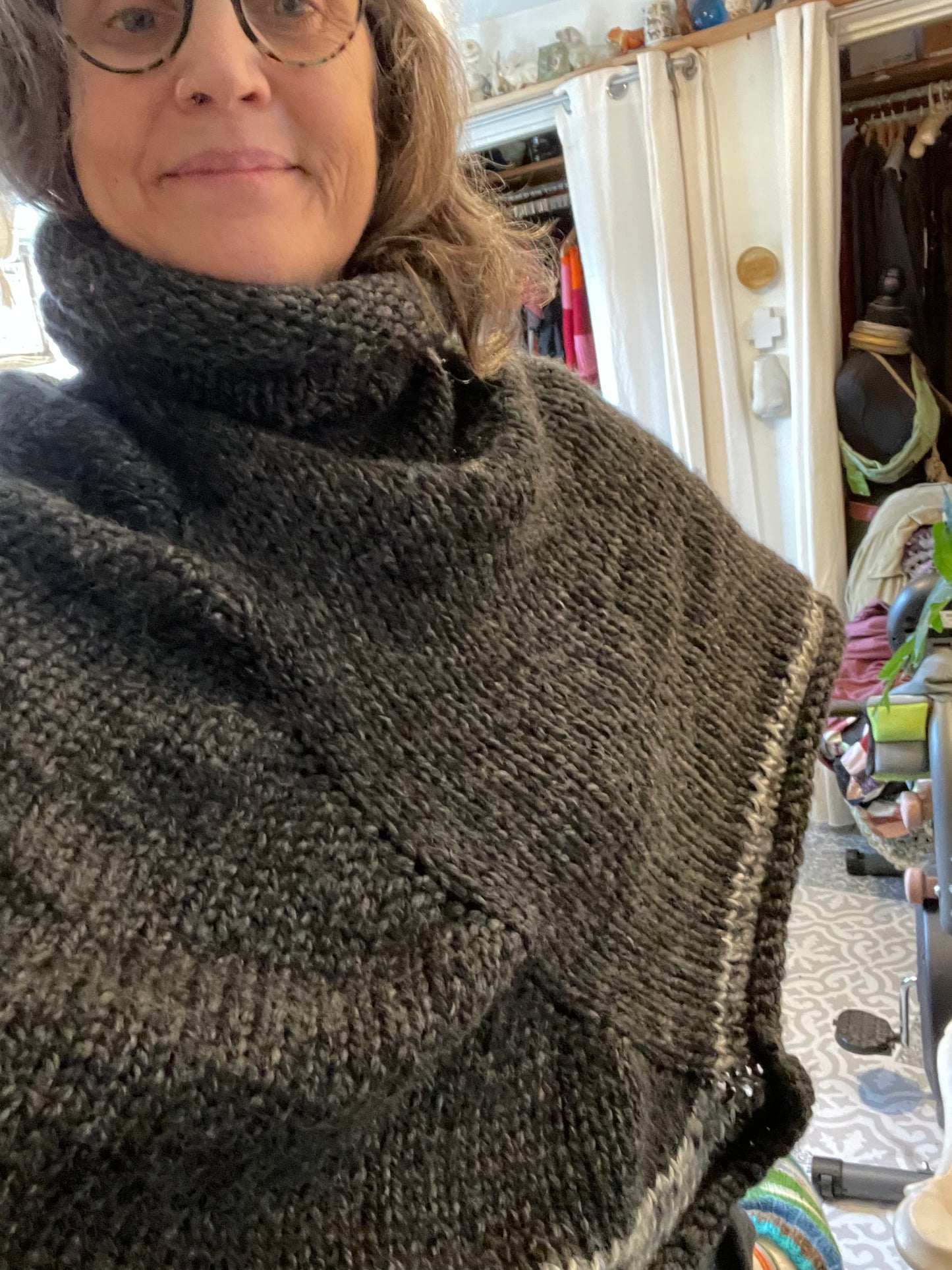 Hand knitted rolled turtleneck poncho charcoal grey with striped edging