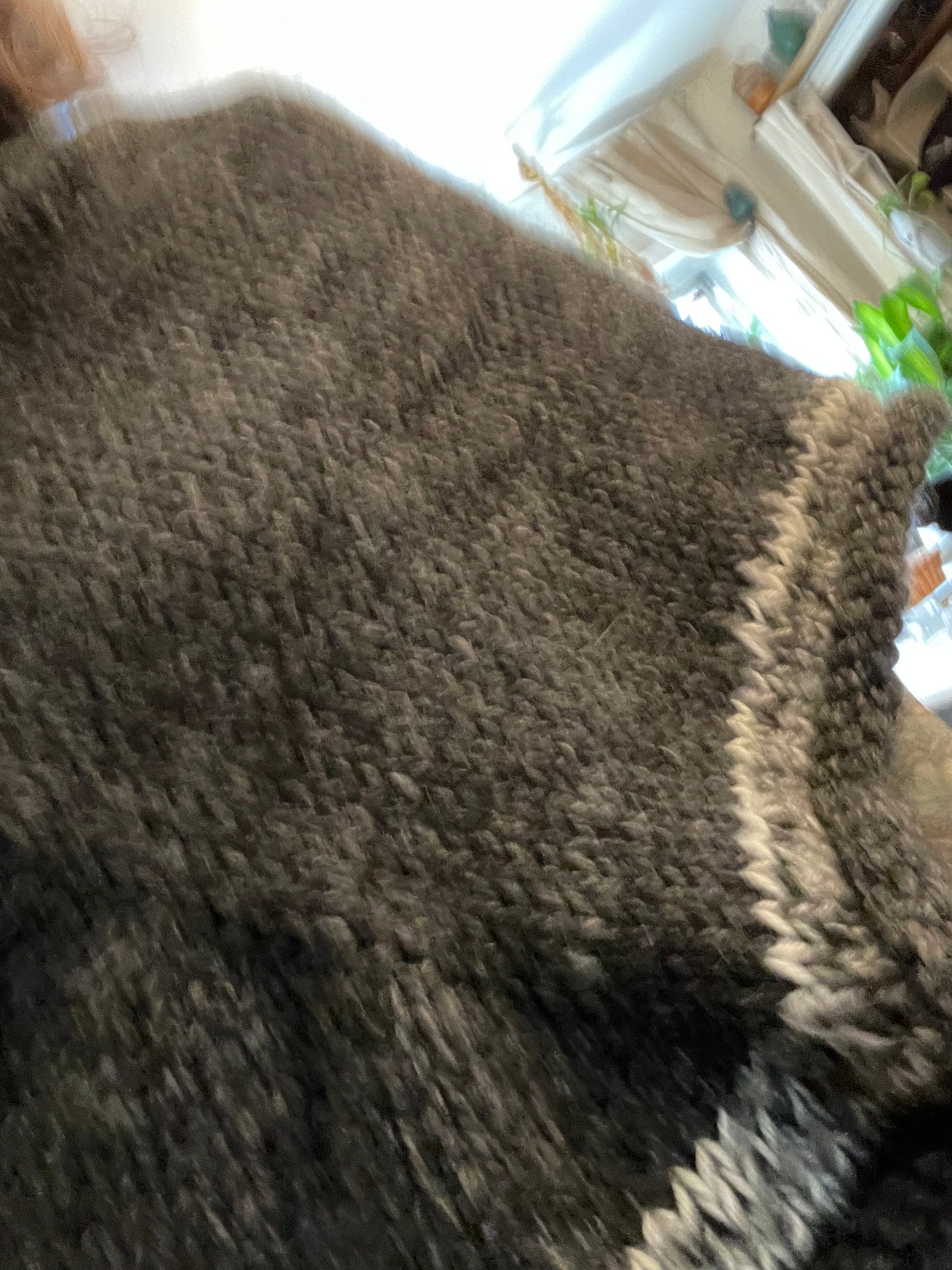 Hand knitted rolled turtleneck poncho charcoal grey with striped edging