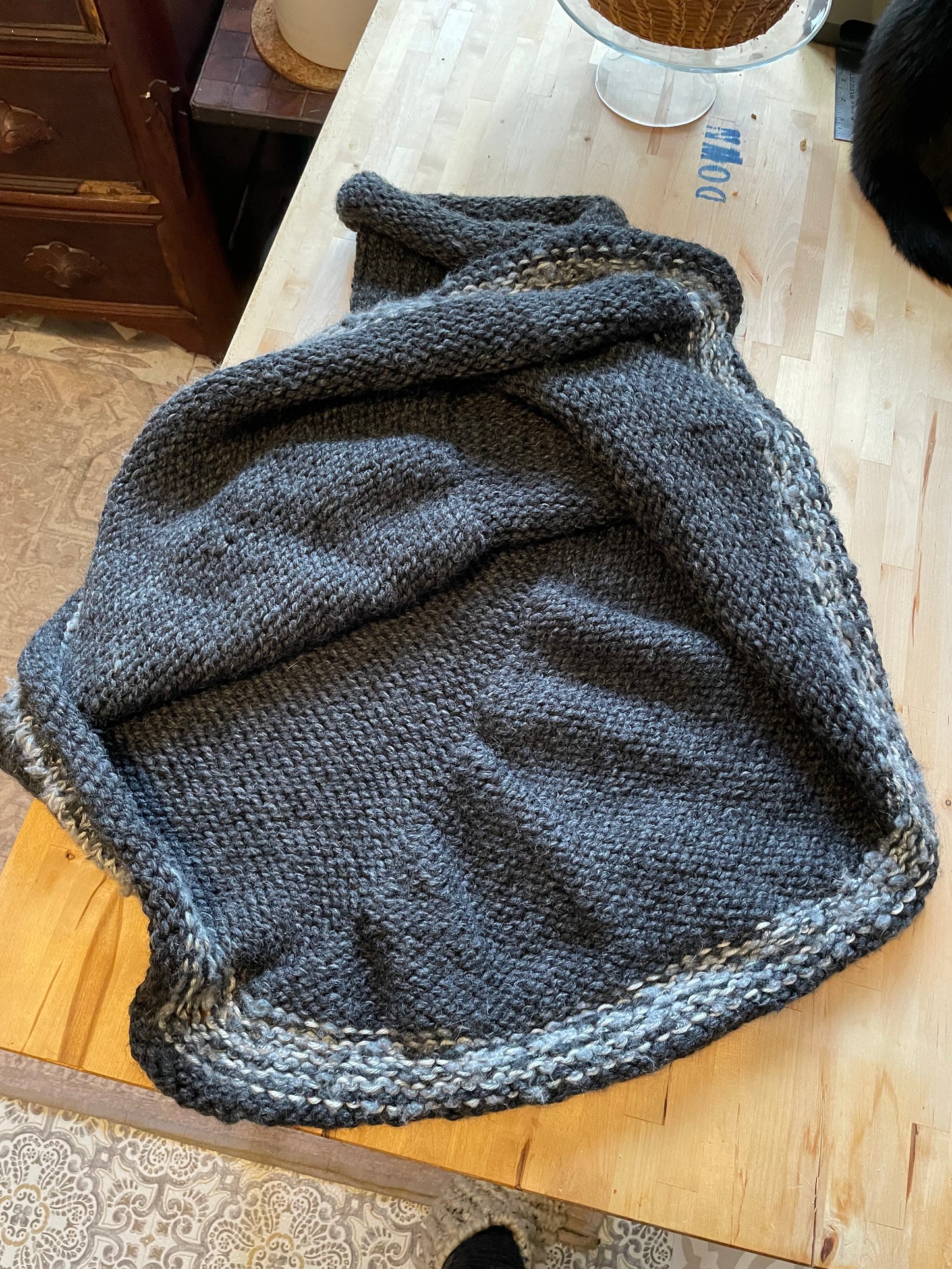 Hand knitted rolled turtleneck poncho charcoal grey with striped edging