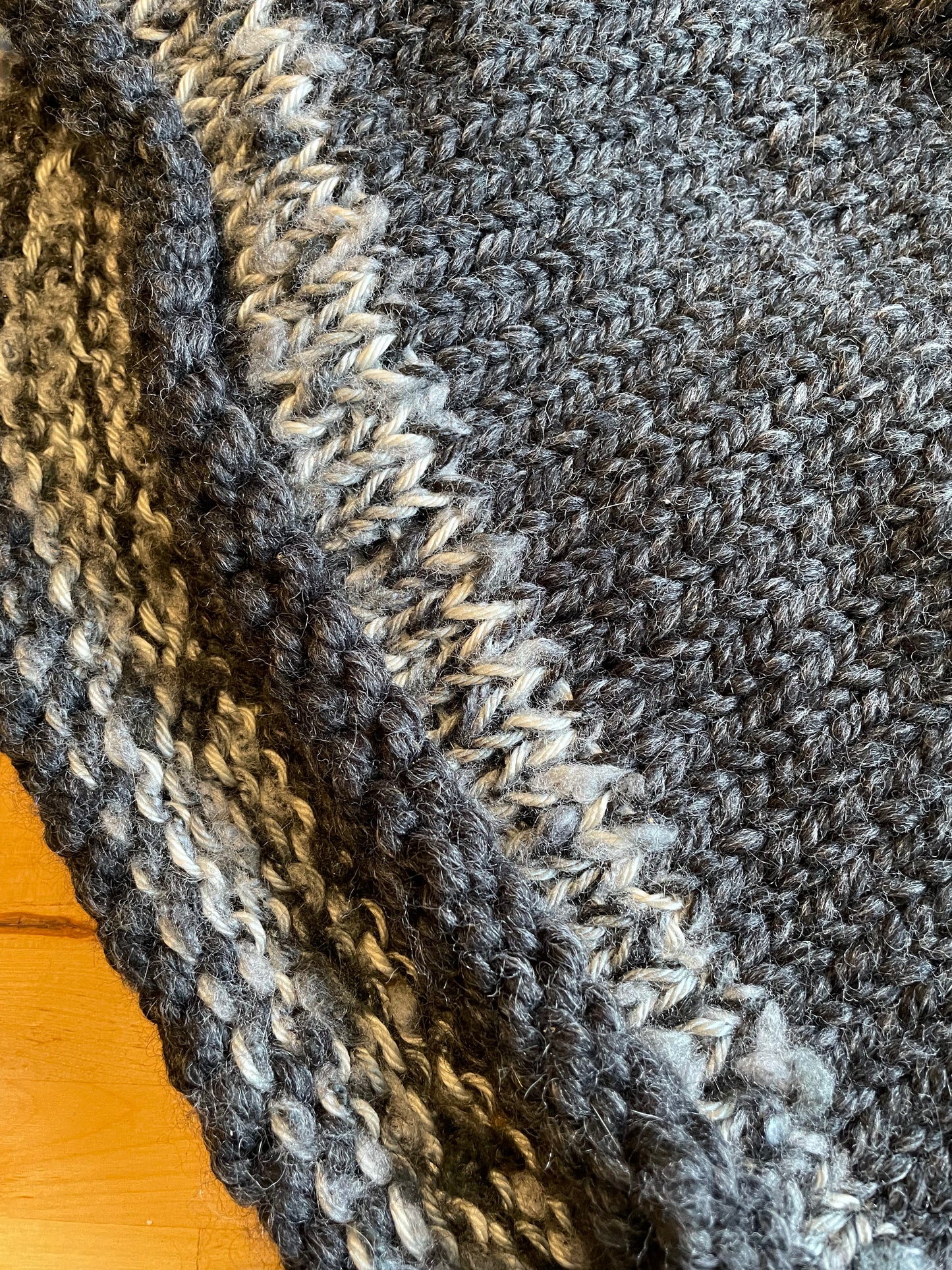 Hand knitted rolled turtleneck poncho charcoal grey with striped edging