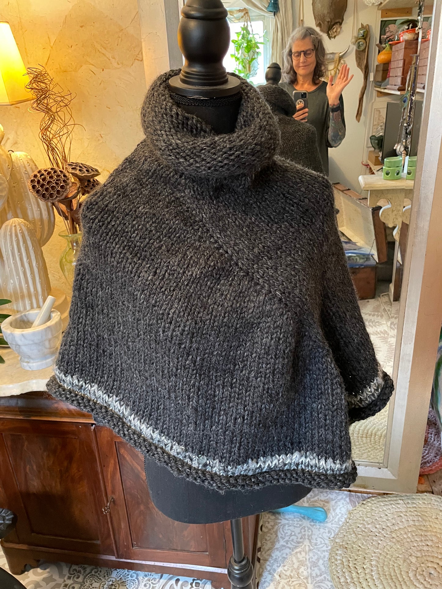 Hand knitted rolled turtleneck poncho charcoal grey with striped edging