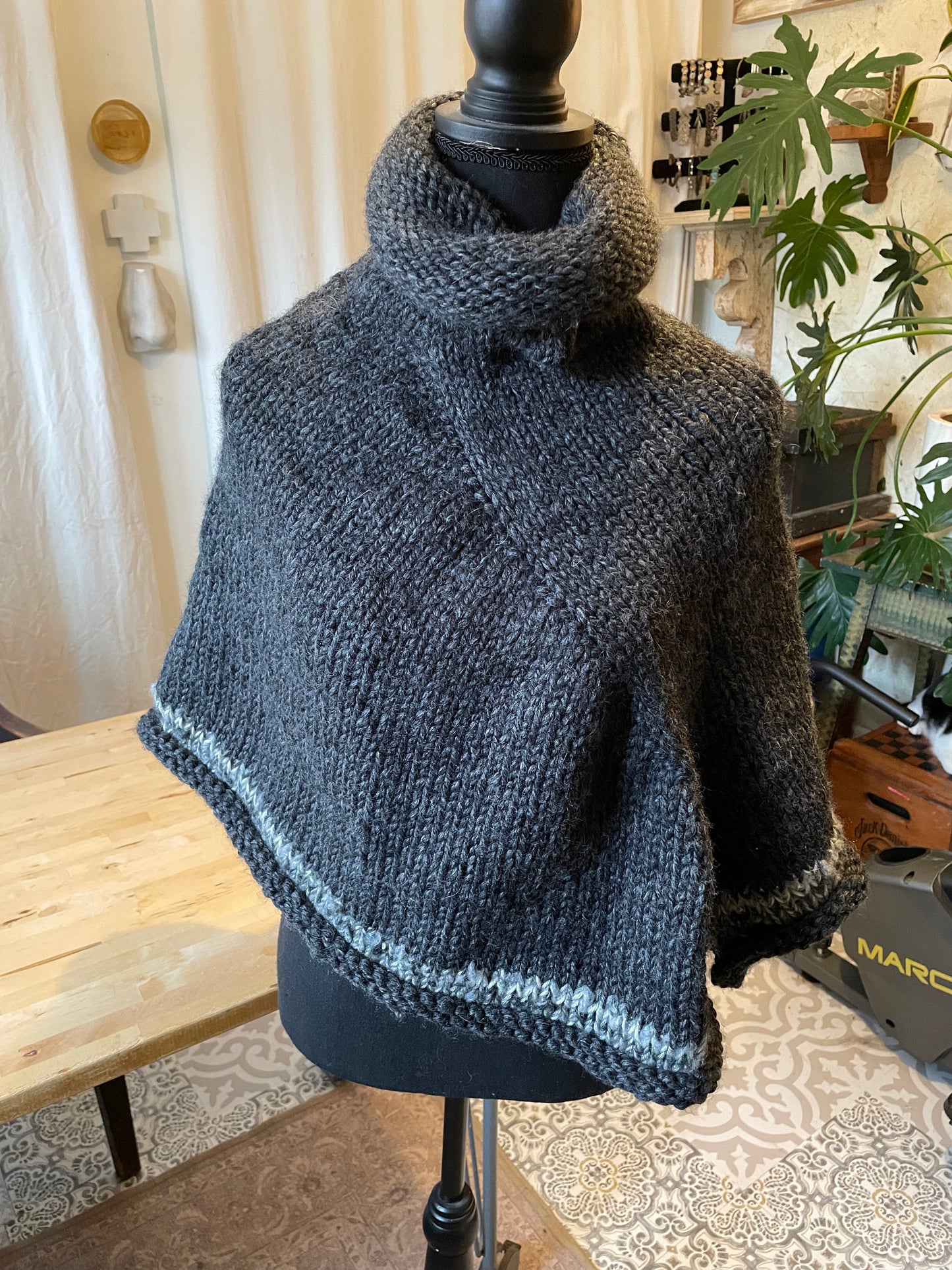 Hand knitted rolled turtleneck poncho charcoal grey with striped edging