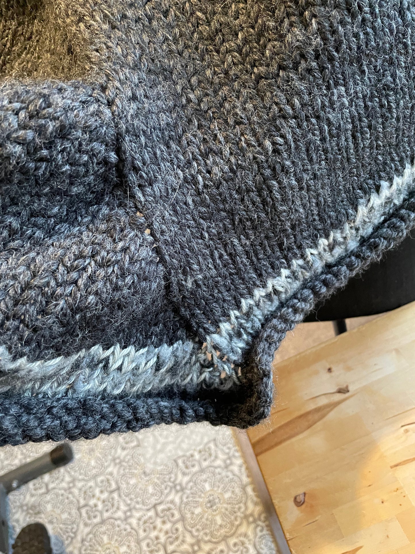 Hand knitted rolled turtleneck poncho charcoal grey with striped edging